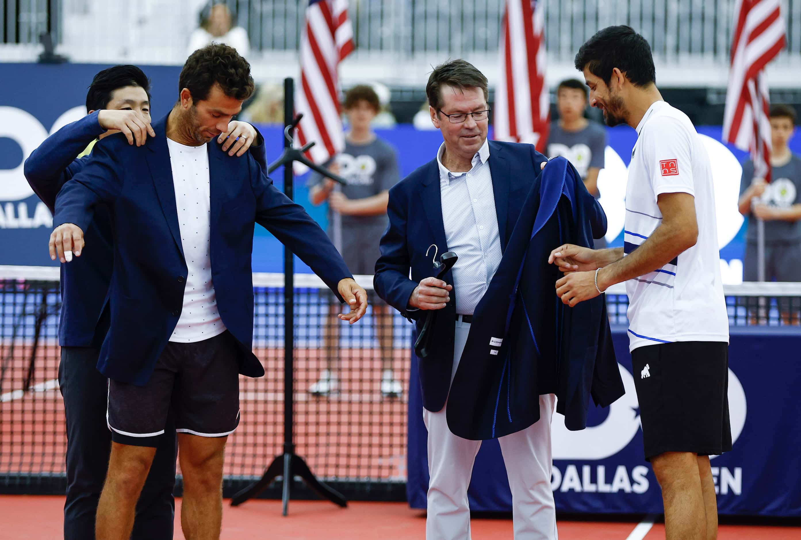 SMU Tennis coach Grant Chen, back left, and ATP Dallas Open Tournament Director Peter...