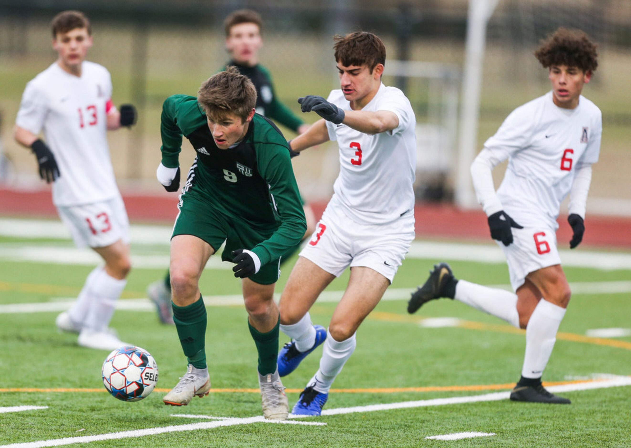 Prosper's Jack Simonini (9) makes a drive past Allen's Chase Duhon (3) during Prosper's 1-0...