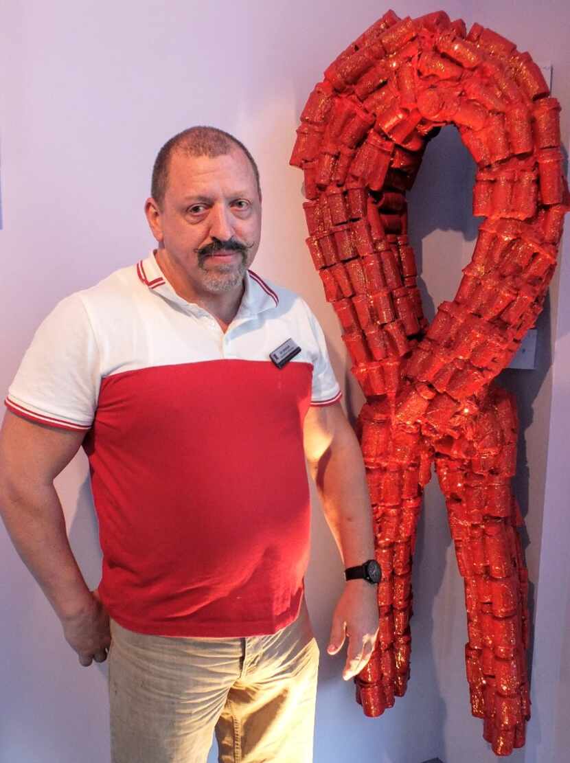 Ed Sparan with an AIDS ribbon made from prescription bottles inside the World AIDS Museum....