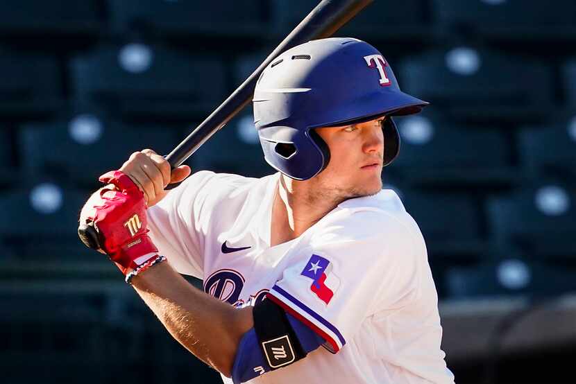 Texas Rangers third baseman Josh Jung bats during the ninth inning of a spring training game...