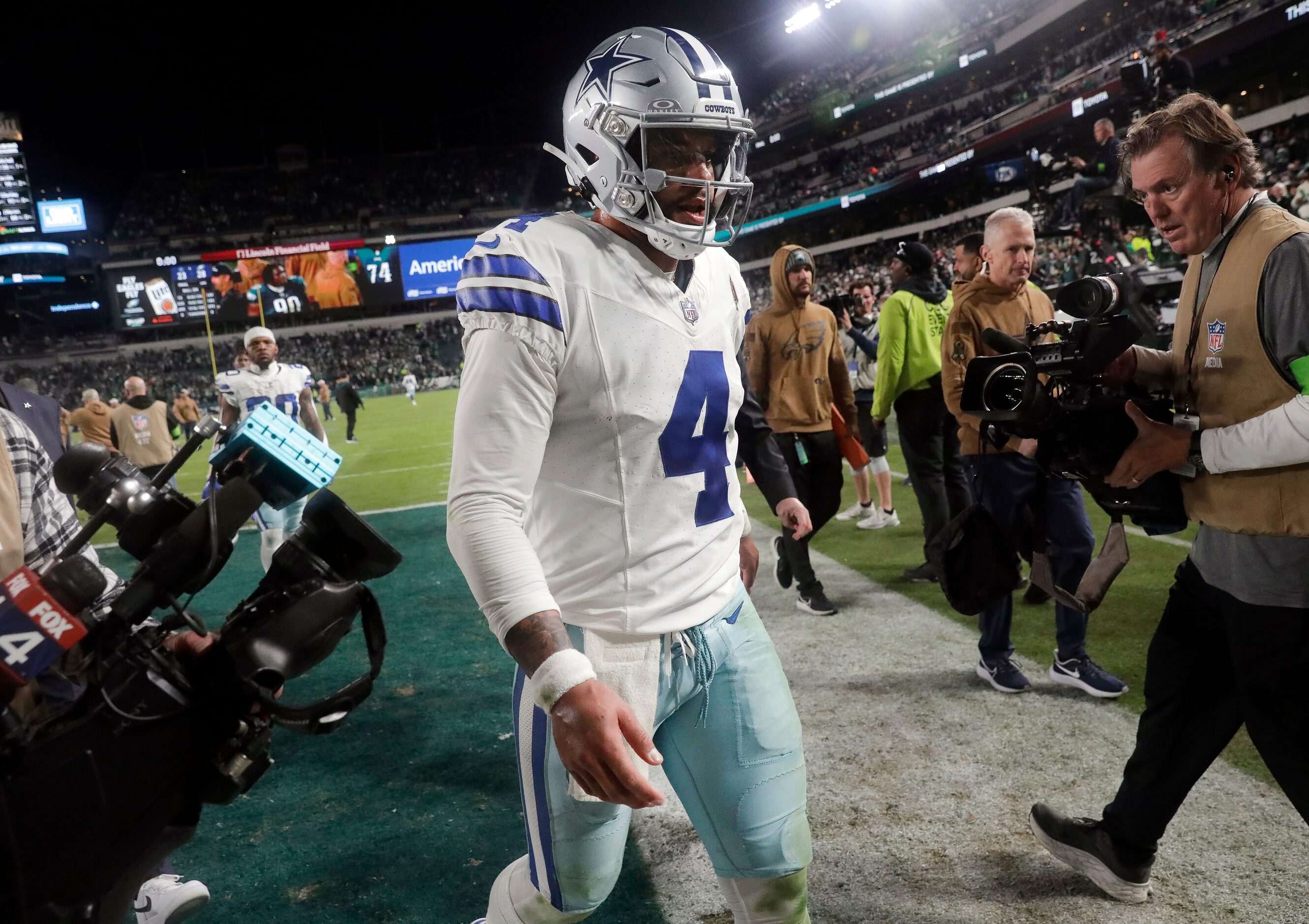 Dallas Cowboys quarterback Dak Prescott (4) walks off the field after their loss to the...