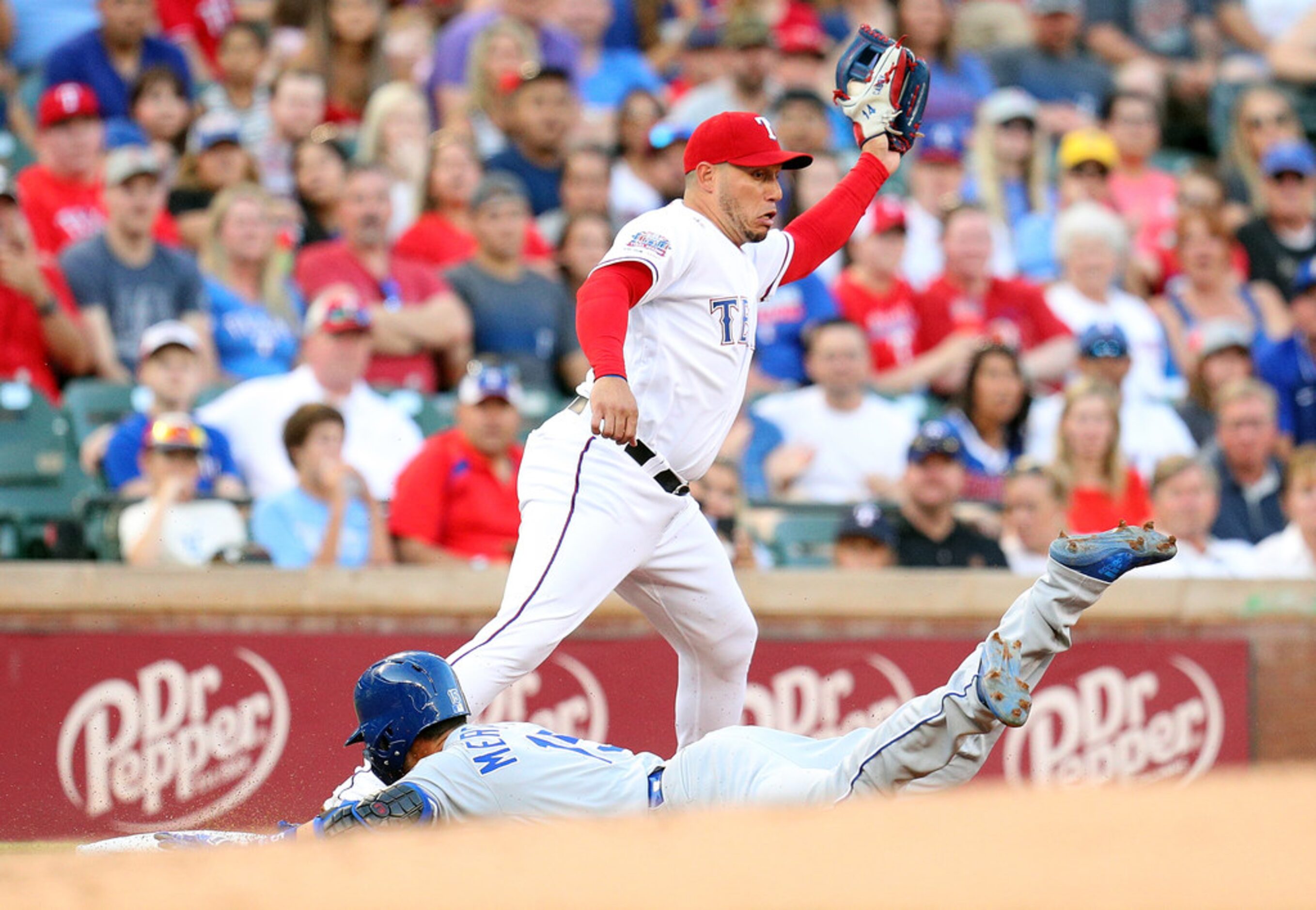 ARLINGTON, TEXAS - MAY 31: \Whit Merrifield #15 of the Kansas City Royals slides into third...