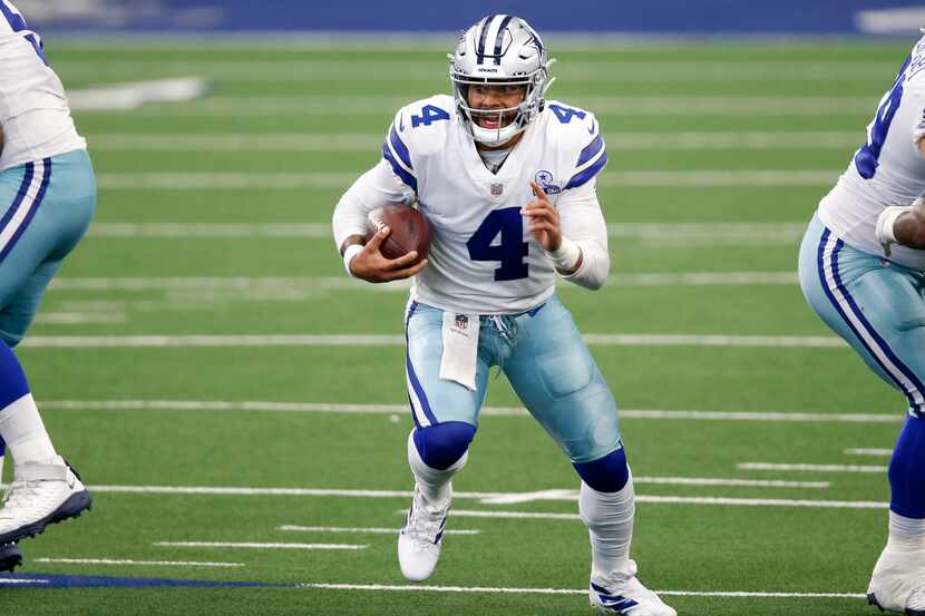 Dallas Cowboys quarterback Dak Prescott (4) runs up the field during second half of play...