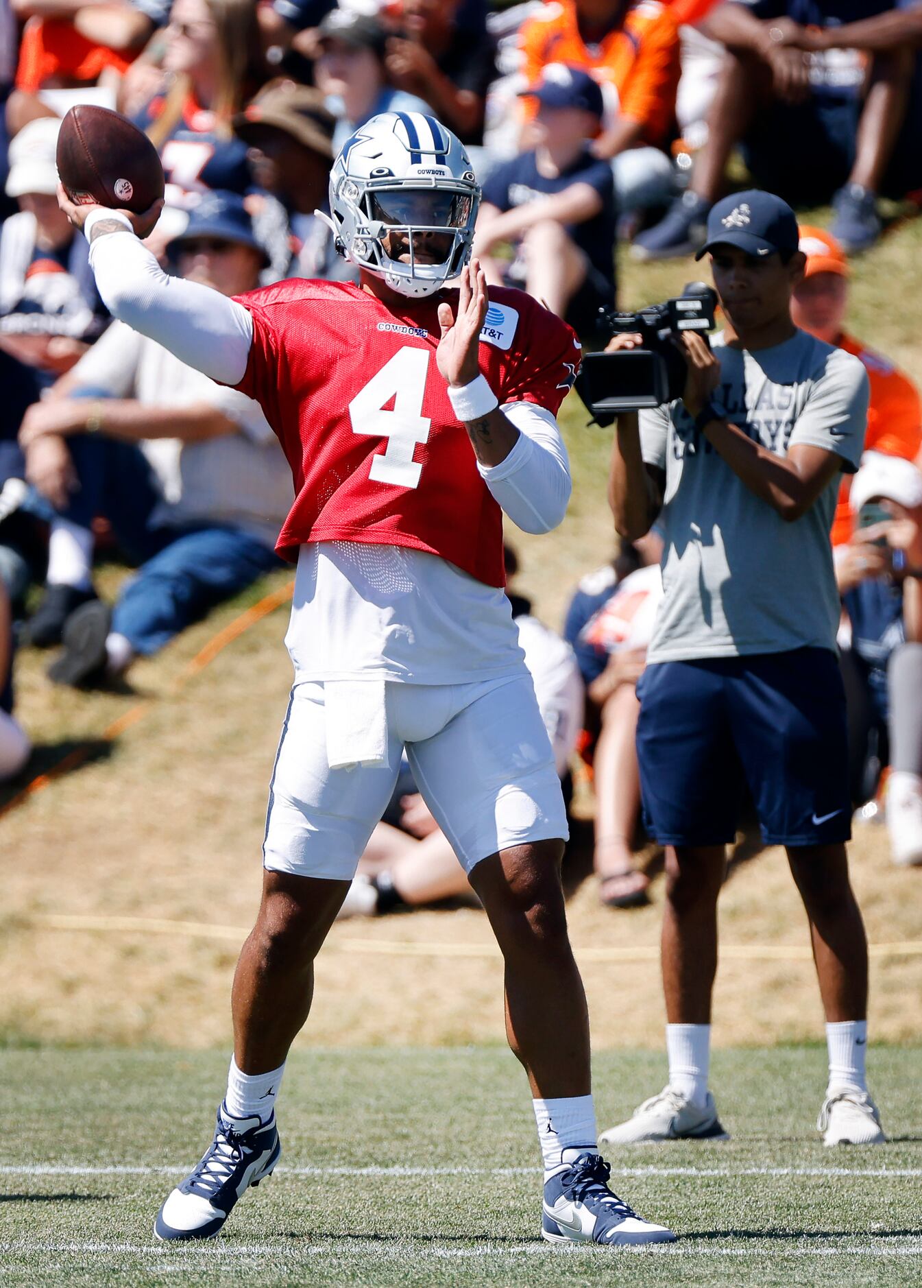 Dallas Cowboys quarterback Dak Prescott (4) throws a pass prior to practicing with the...