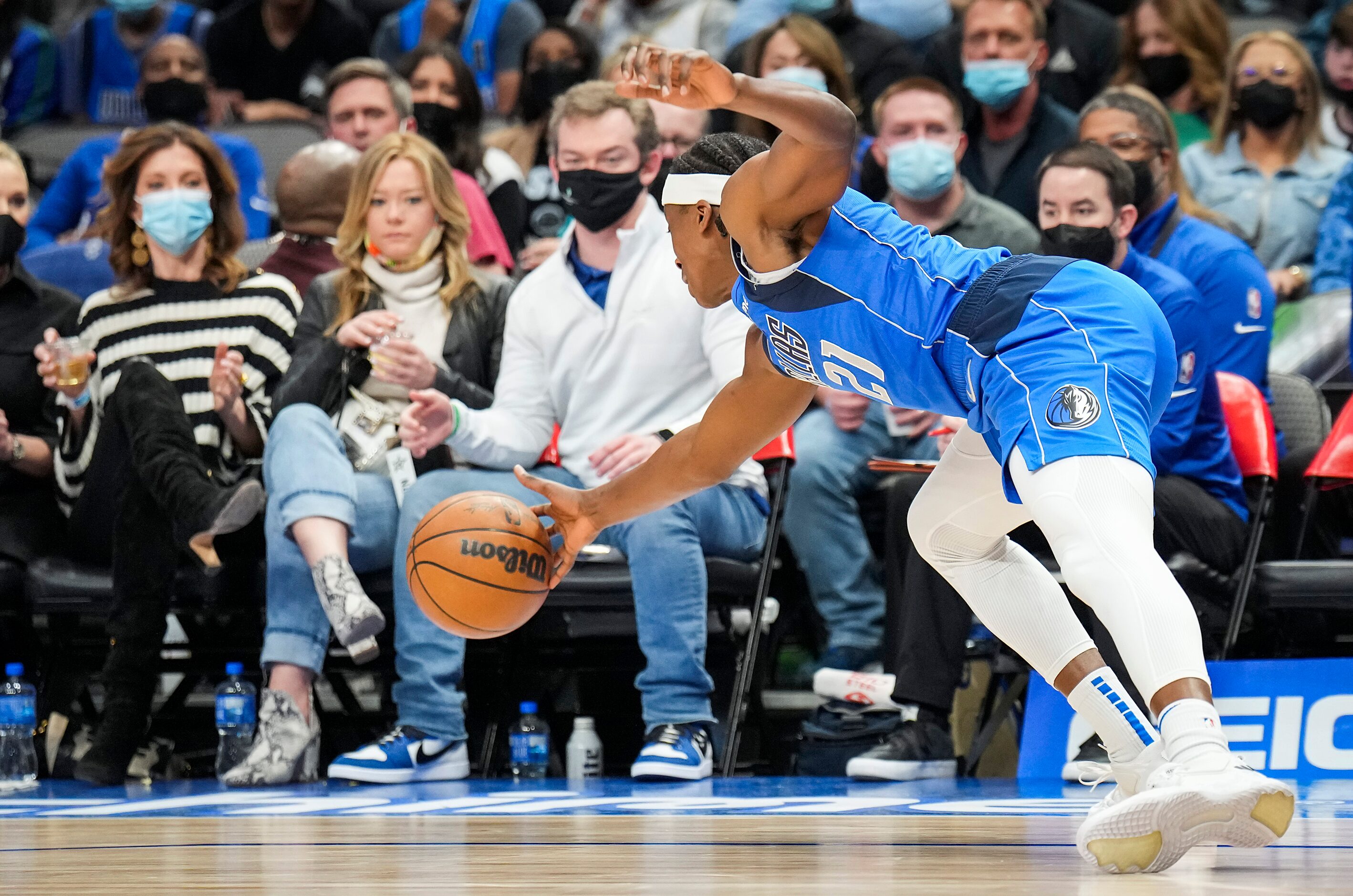 Dallas Mavericks guard Frank Ntilikina (21) dives to try and keep a ball in bounds during...