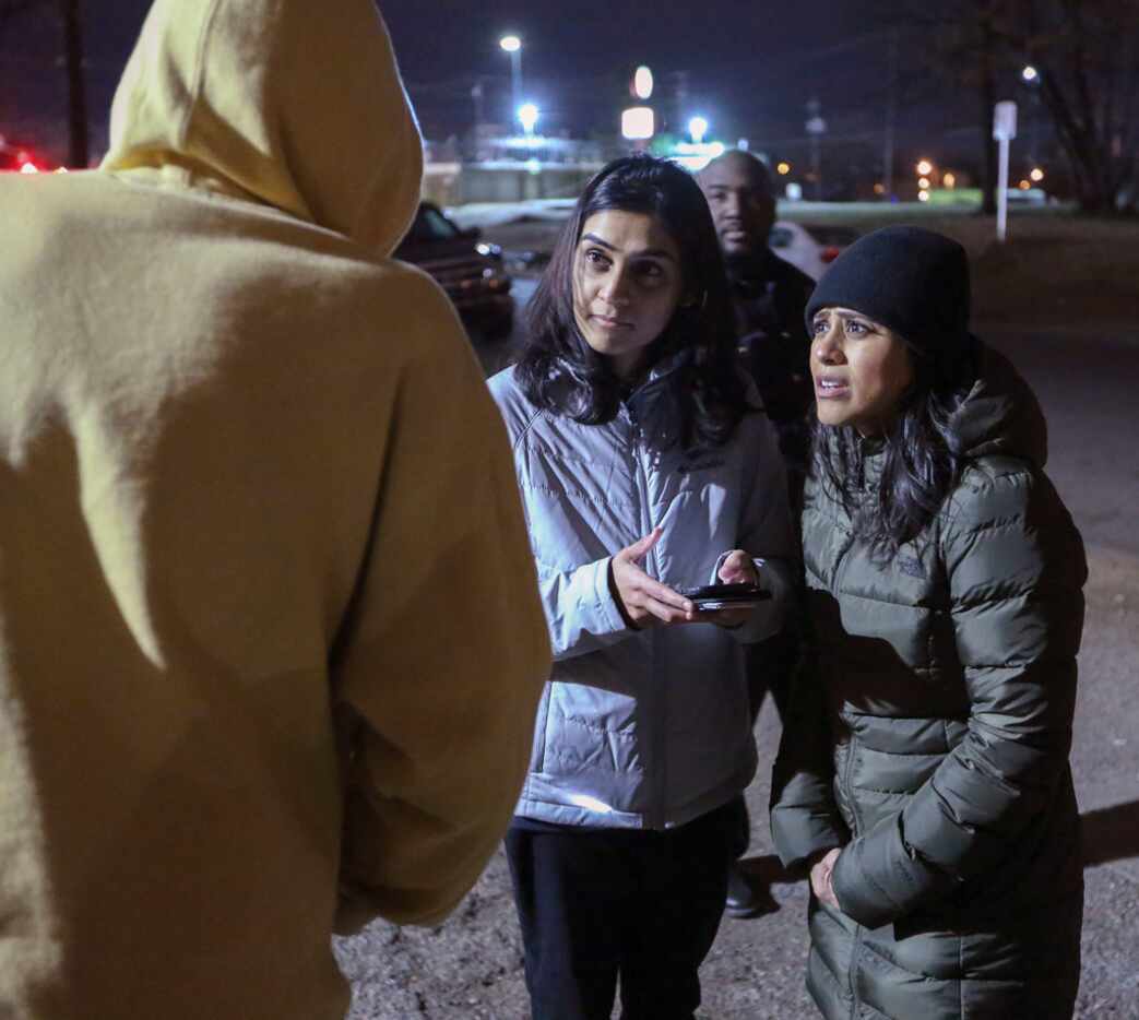 Metro Dallas Homeless Alliance volunteers Nazia Shaik (center) and Sana Syed interview a...