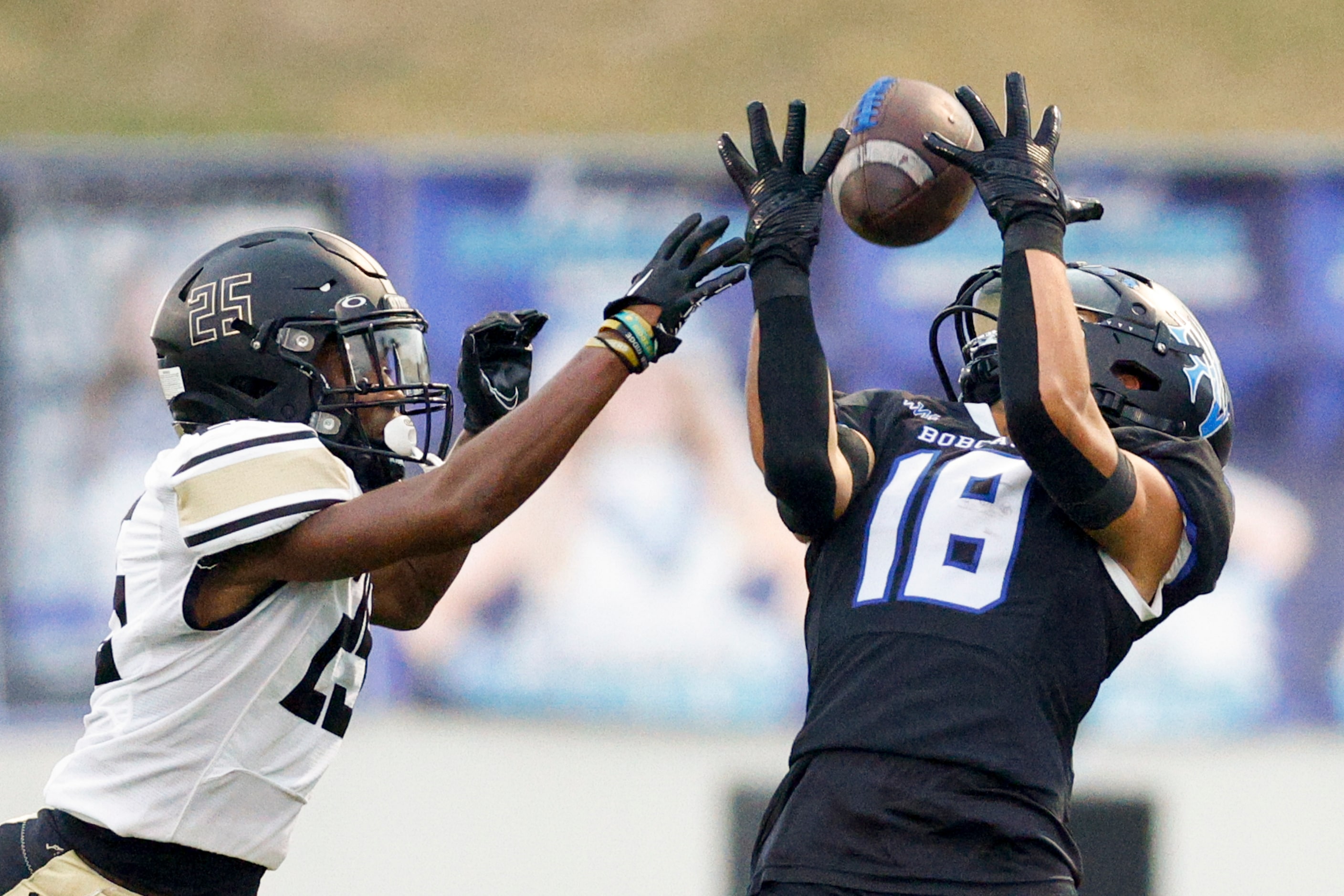 Trophy Club Byron Nelson wide receiver Ezra Malamura (18) hauls in a catch over Keller...