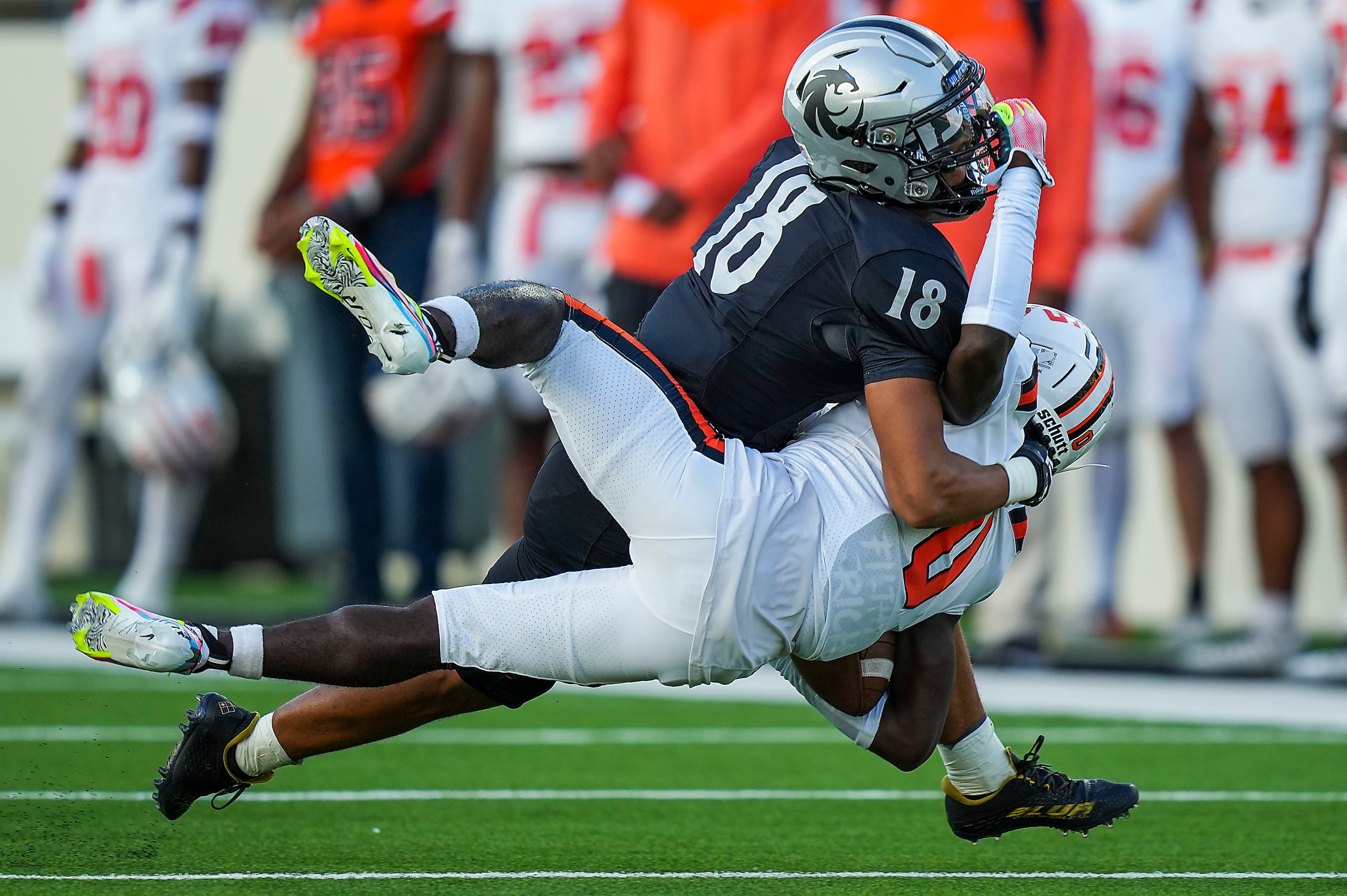 Lancaster wide receiver Ti'Erick Martin (0) is brought down by Denton Guyer defensive back...