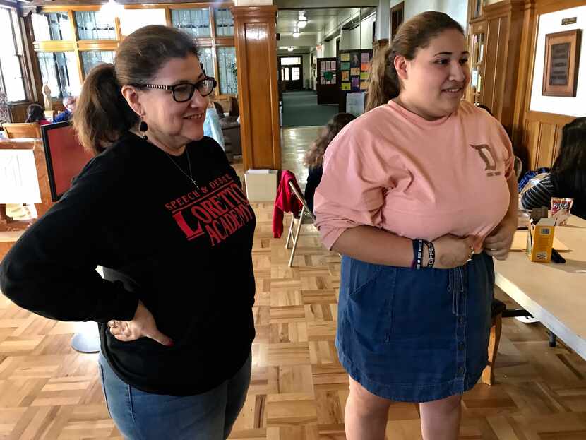 Sofia Almanzan (right) stands with her mother, Sandra, during a high school debate that...