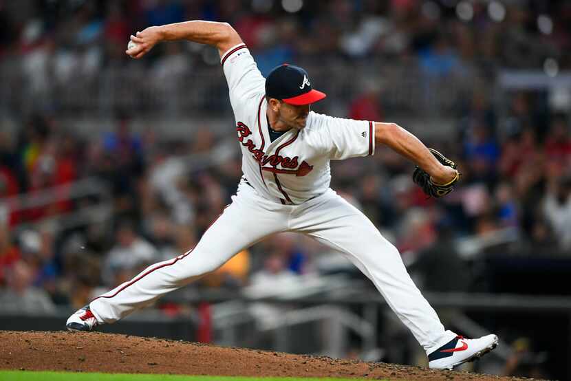 Atlanta Braves pitcher Darren O'Day works against the San Francisco Giants during a baseball...