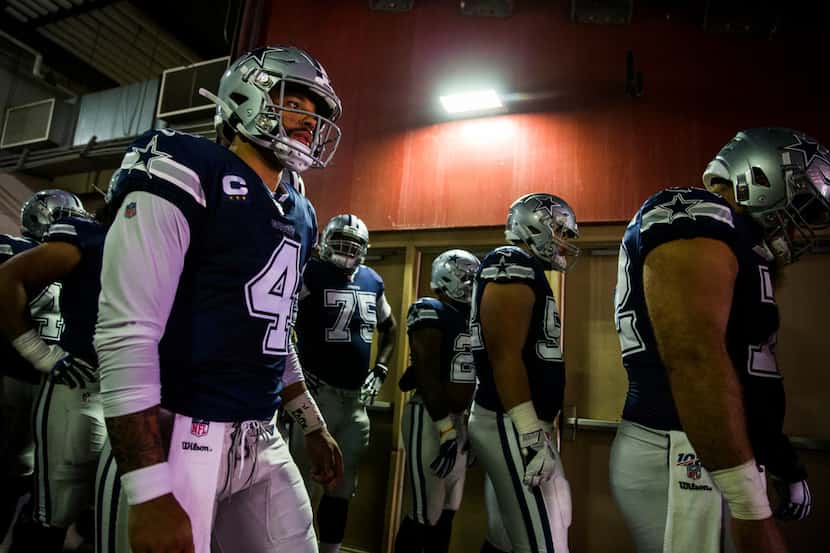Dallas Cowboys quarterback Dak Prescott (4) and other players wait in the tunnel before an...