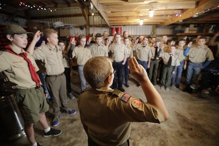 A Boy Scouts troop gathers during a meeting, in Kaysville, Utah. For decades, The Church of...