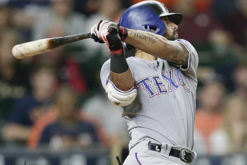 HOUSTON, TX - JUNE 13:  Rougned Odor #12 of the Texas Rangers hits a two-run home run in the...