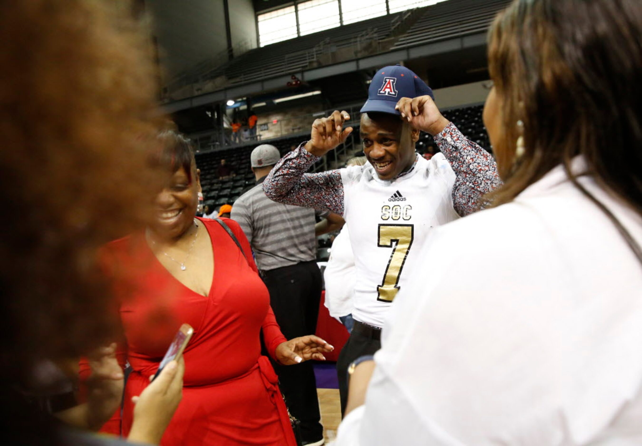 South Oak Cliff's Derrion Clark, who signed with the University of Arizona, celebrates with...