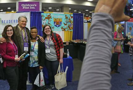 A group of librarians pose with John Erickson, author of the Hank the Cowdog books, at the...