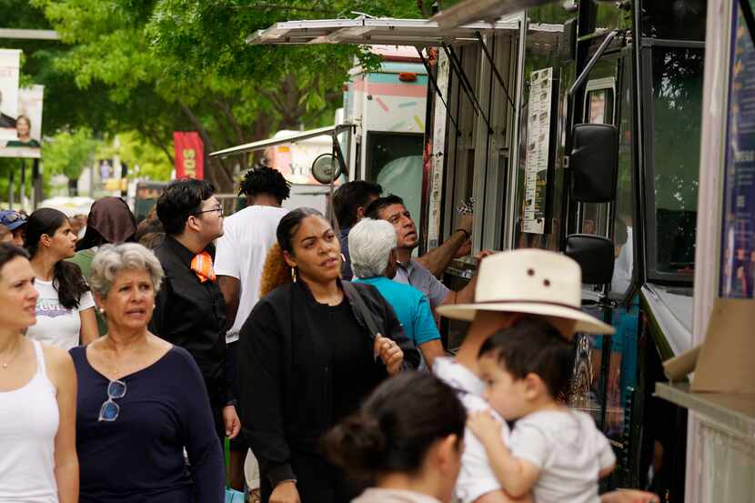 Food trucks lined the street at the AVANCE Latino Street Fest at Klyde Warren Park in...