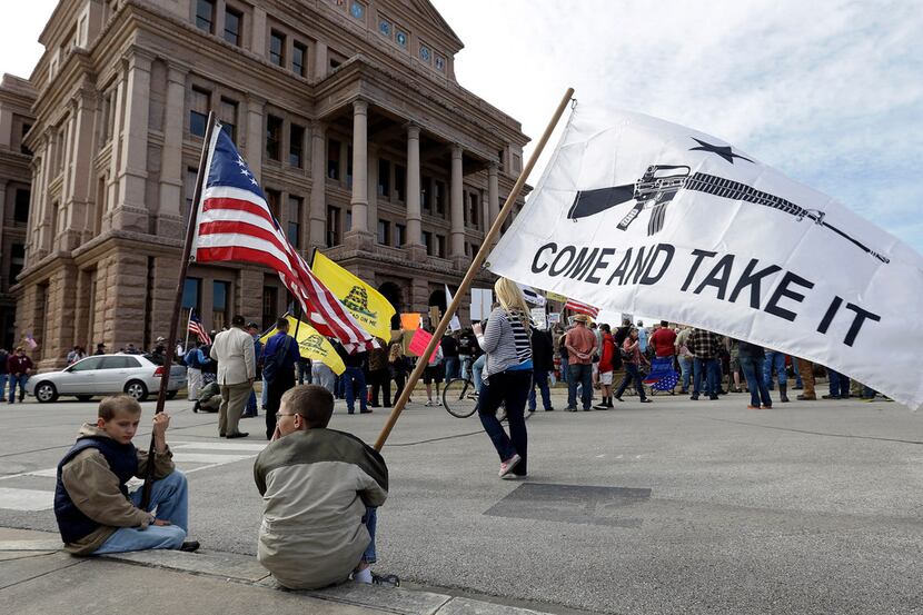 Gun rights supporters gather at a Guns Across America rally at the Texas Capitol in January...