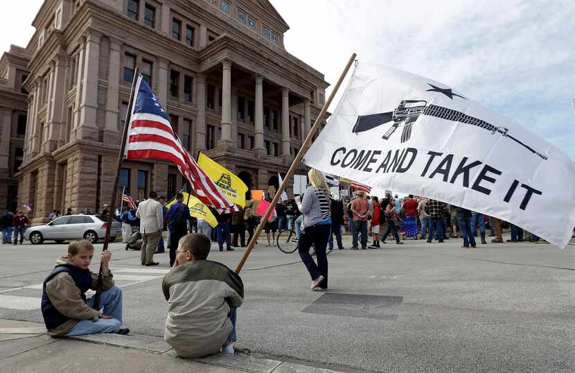 Gun rights supporters gather at a Guns Across America rally at the Texas Capitol in January...