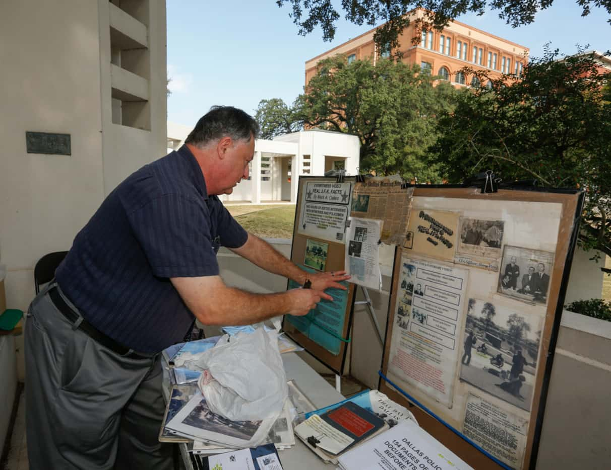 Mark A. Oakes, a JFK assassination researcher, sets up his display at Dealey Plaza. Oakes...