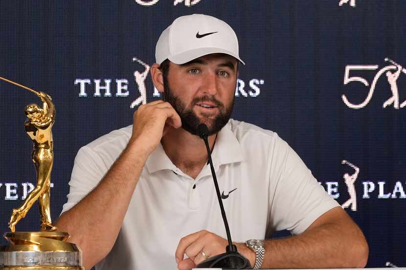 Scottie Scheffler speaks to the media after winning The Players Championship golf tournament...