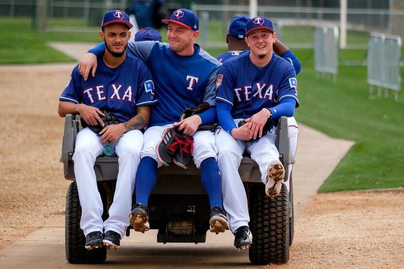 From left: Texas Rangers pitchers Jonathan Hernandez, Adrian Sampson and Nick Gardewine ride...