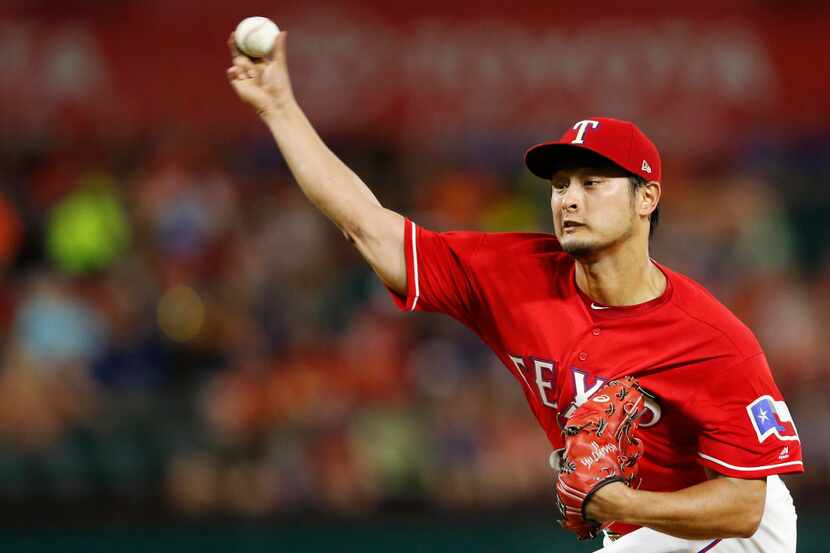 Texas Rangers starting pitcher Yu Darvish (11) pitches in the first inning of play against...