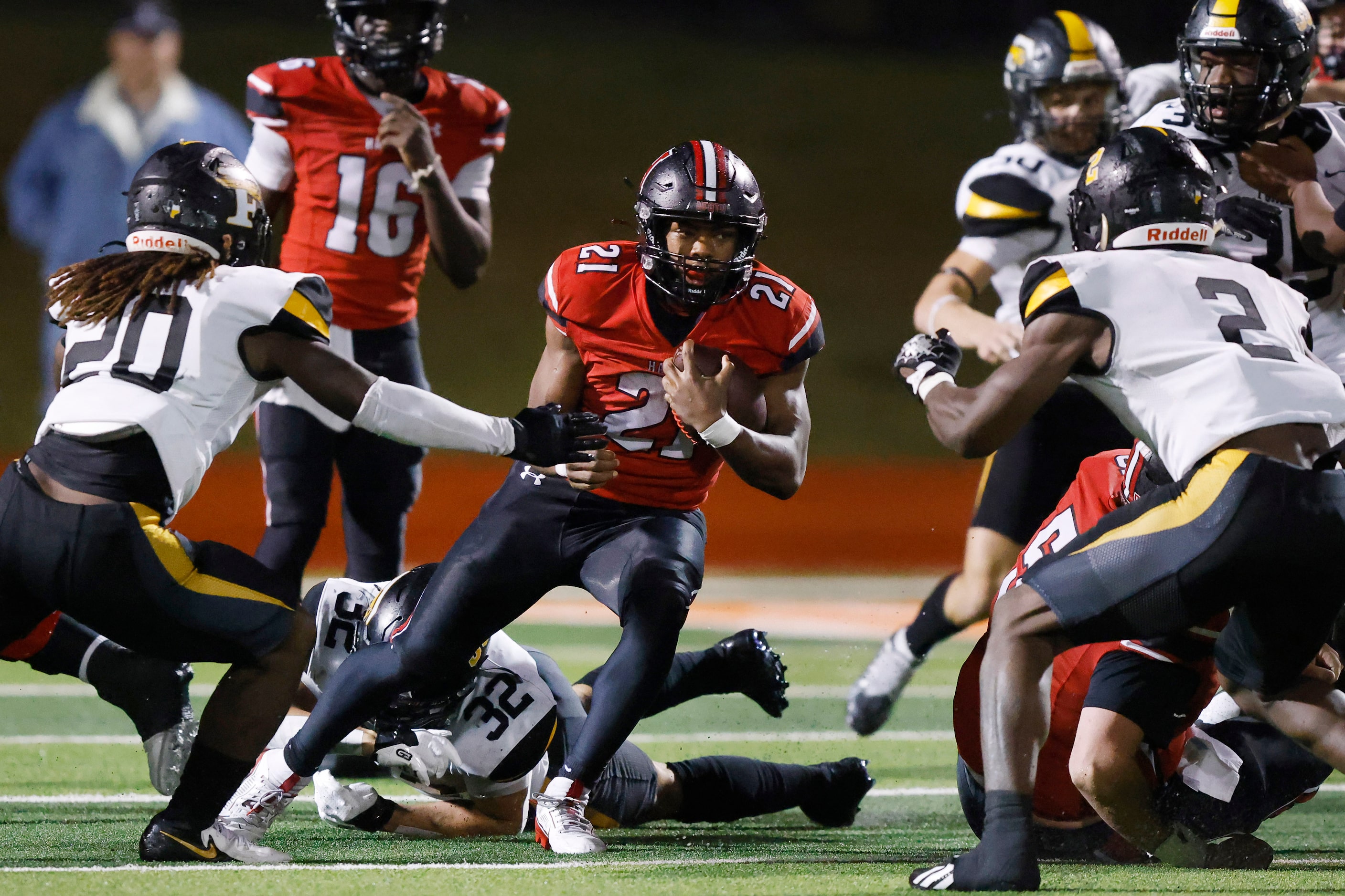 Rockwall-Heath running back Ashton Bradford (21) finds a seam in the Forney defense during...