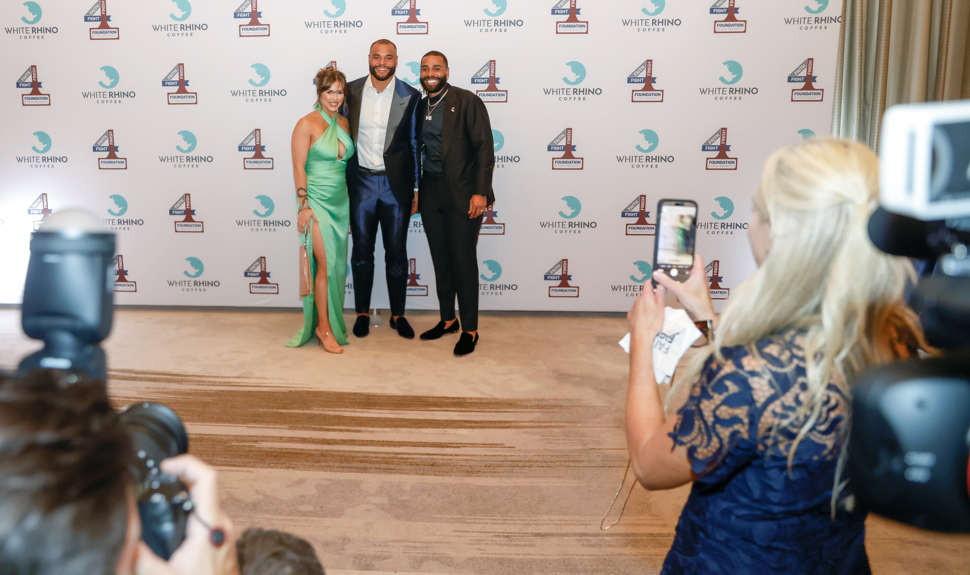 Founder and Dallas Cowboys quarterback Dak Prescott poses with family and friends at the...