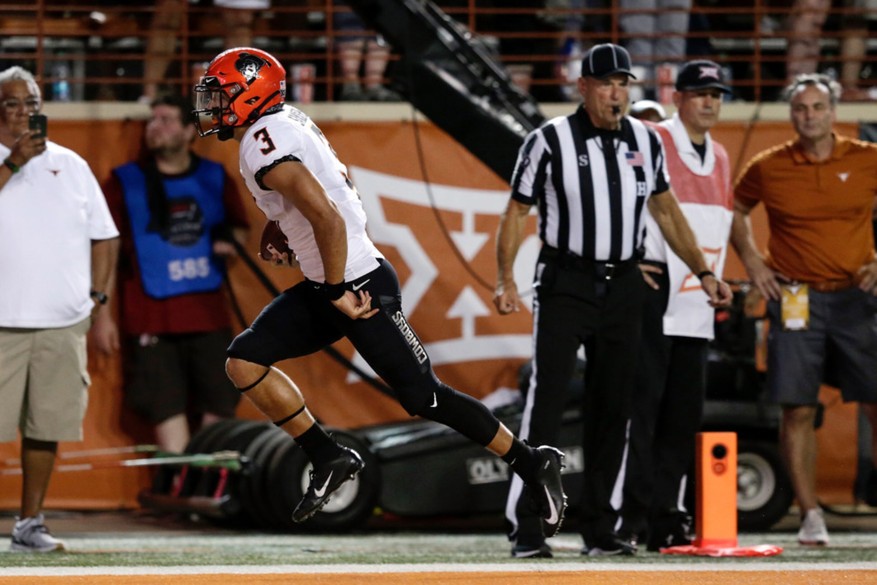 AUSTIN, TX - SEPTEMBER 21:  Spencer Sanders #3 of the Oklahoma State Cowboys scores a...