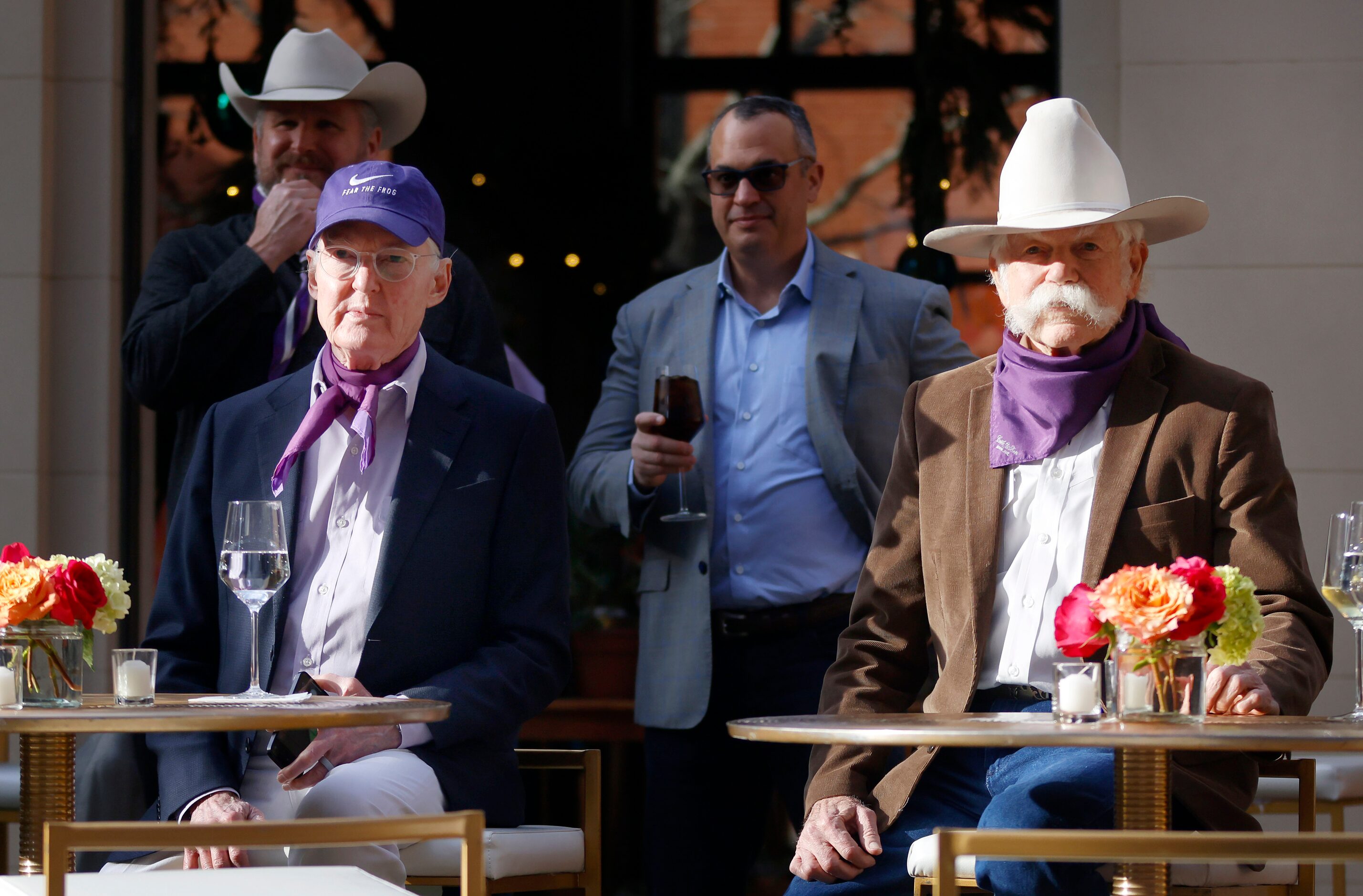 TCU Horned Frogs fans Ed Bass (left) and Steve Murrin (right) watch the team face Michigan...