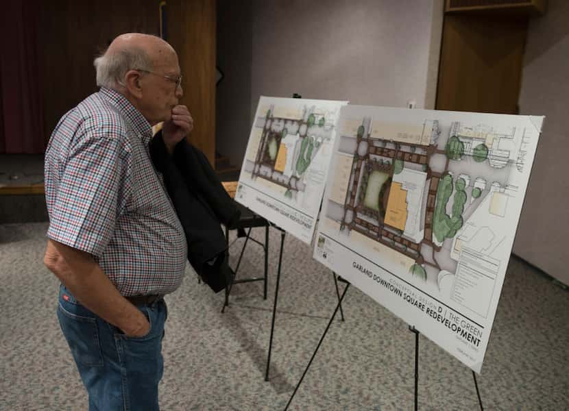 Garland resident Lynn Thurman viewed conceptual drawings of two designs for the downtown...