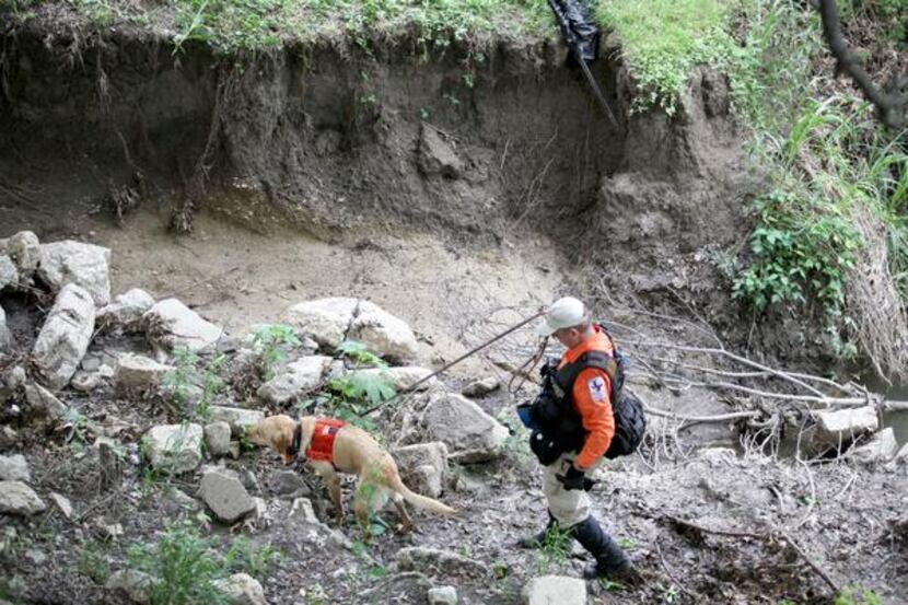 
A team searched under the bridge over White Rock Creek at Westgrove Drive on Tuesday for...