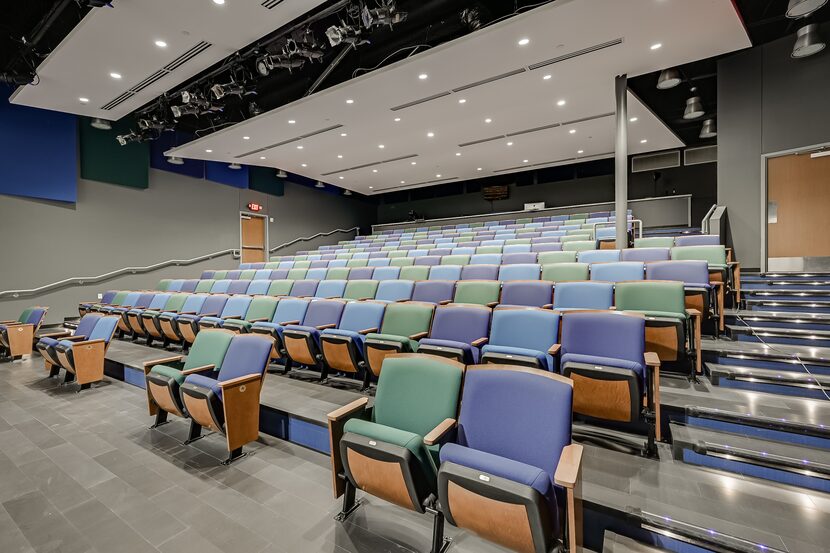 An interior shot of the blue and green seats at Theatre Main.