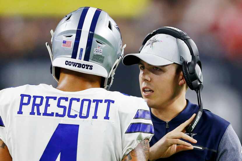 FILE - Kellen Moore talks to Cowboys quarterback Dak Prescott (4)  during the second half of...