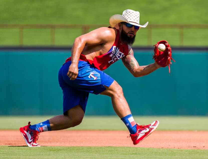 Texas Rangers second baseman Rougned Odor (12) catches a throw during batting practice...