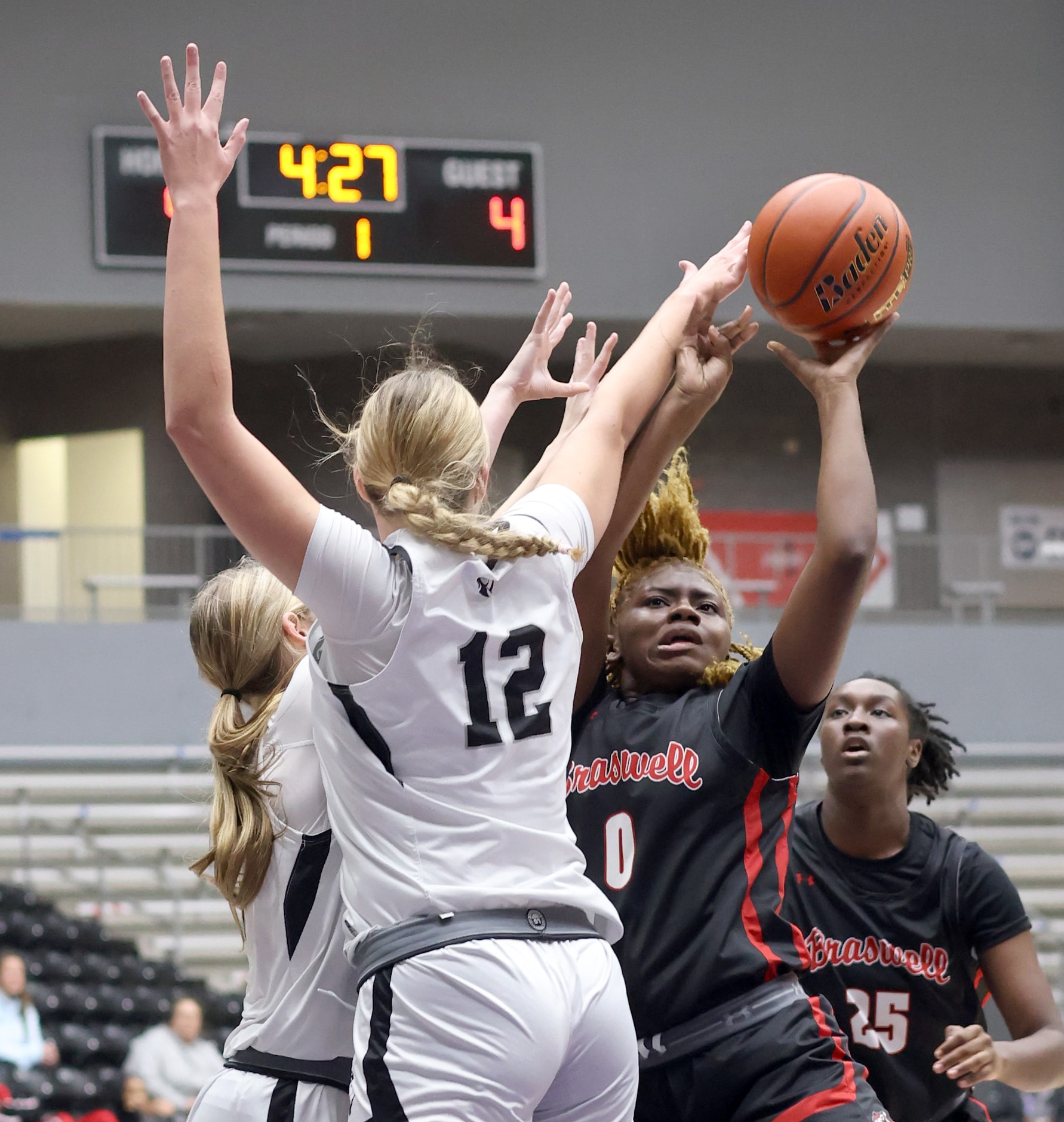 Denton Braswell guard Ytaly Lewis (0), right, gets off a shot under defensive pressure from...