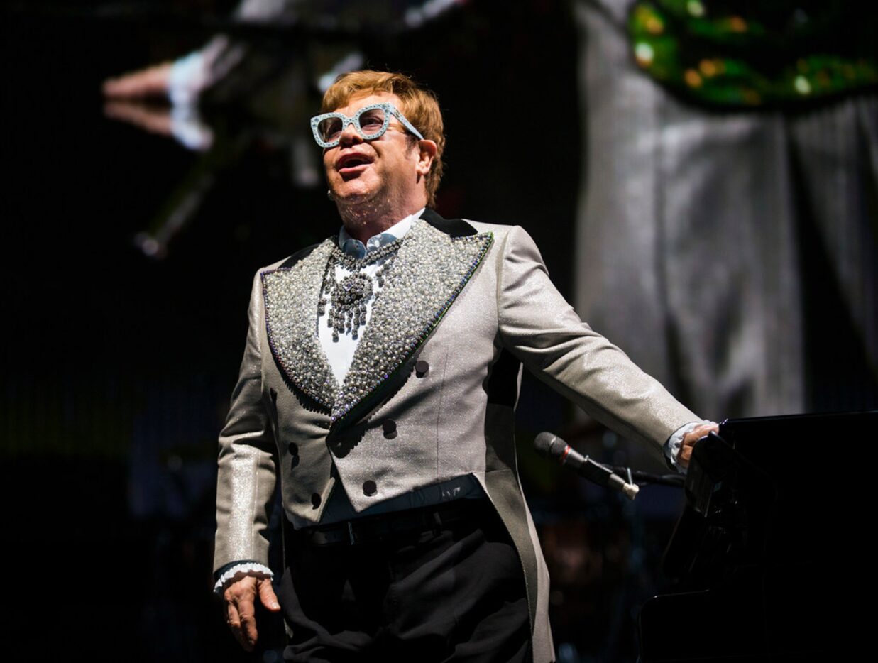 Elton John performs "Bennie and the Jets" at American Airlines Center in Dallas on Friday,...