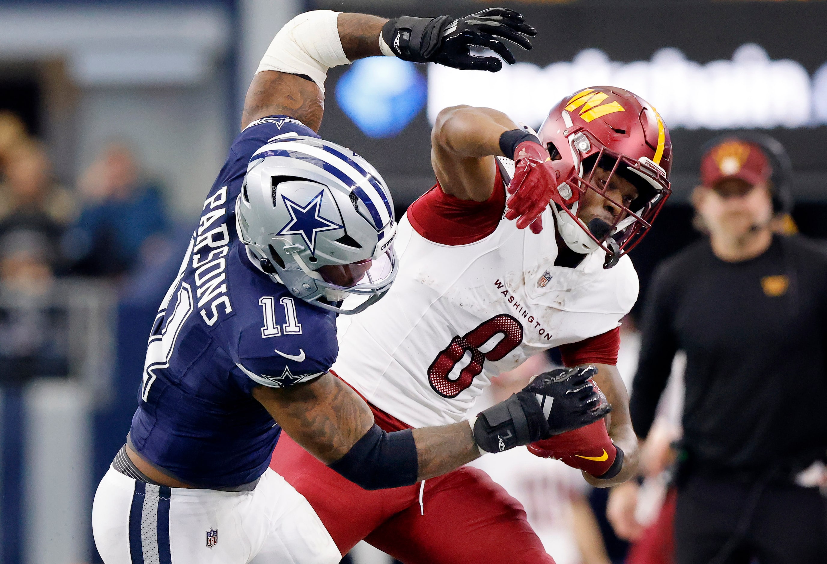 Dallas Cowboys linebacker Micah Parsons (11) forces Washington Commanders running back Brian...