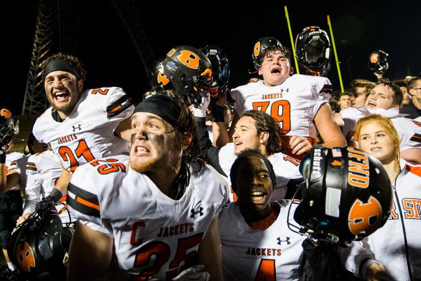 Rockwall celebrates a 48-37 win after a District 11-6A high school football game between...