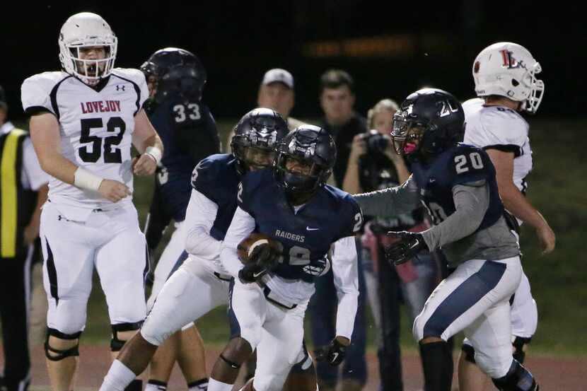 Wylie East defensive back Jimmy Trevillion (22) celebrates with teammates after intercepting...