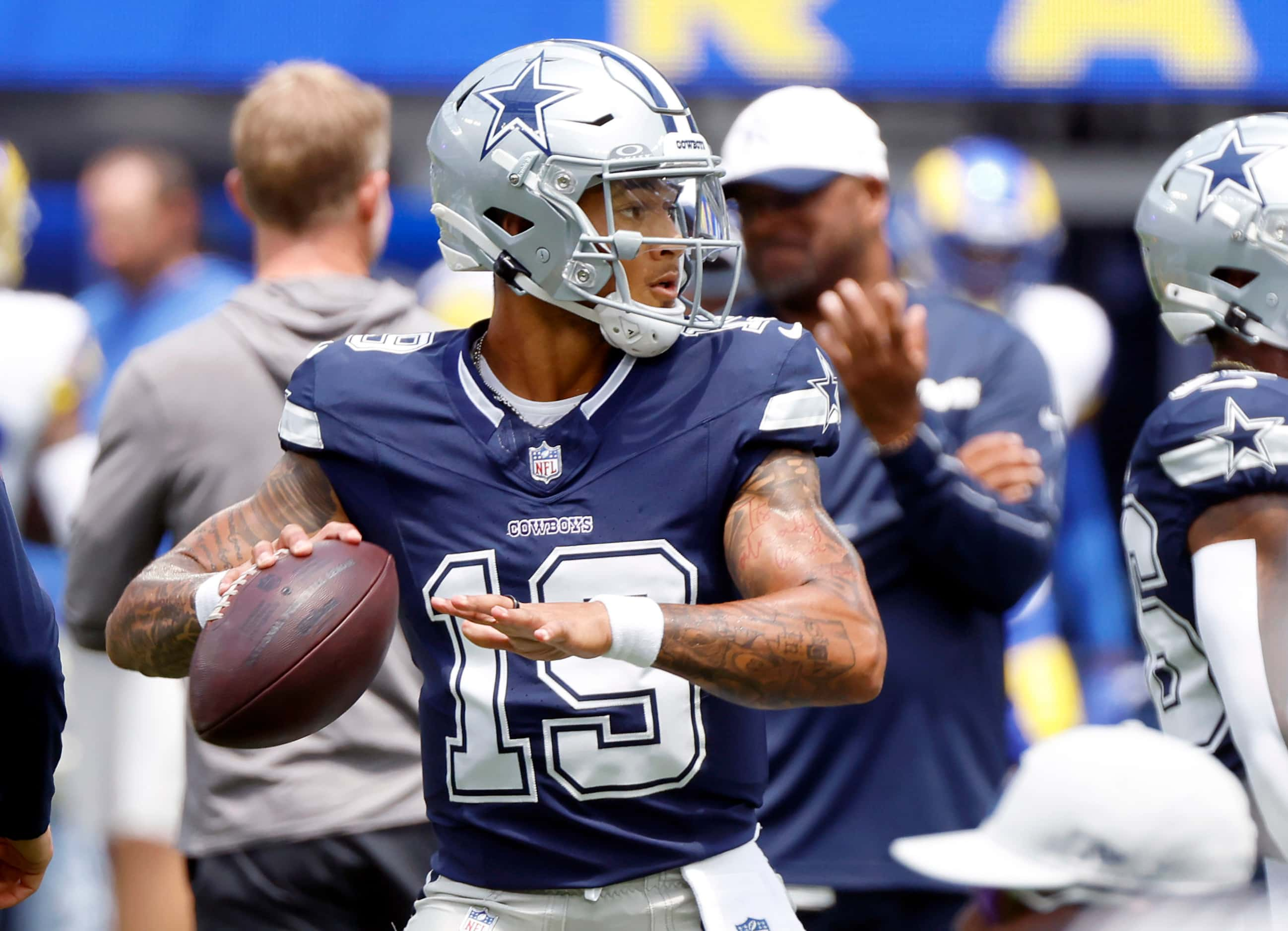 Dallas Cowboys quarterback Trey Lance (19) warms up his arm as he throws during warmups...