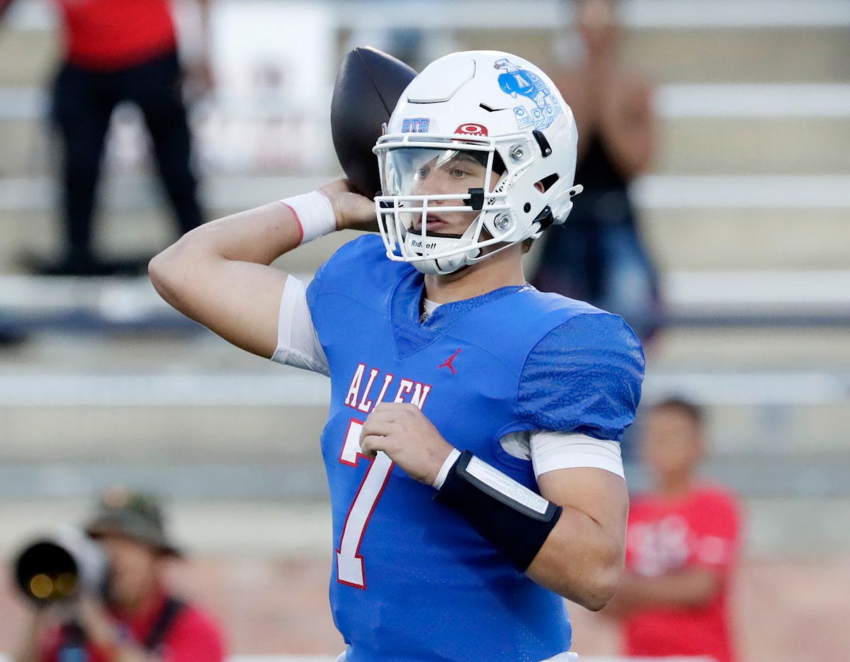 Allen High School quarterback Brady Bricker (7) throws a pass during the first half as Allen...