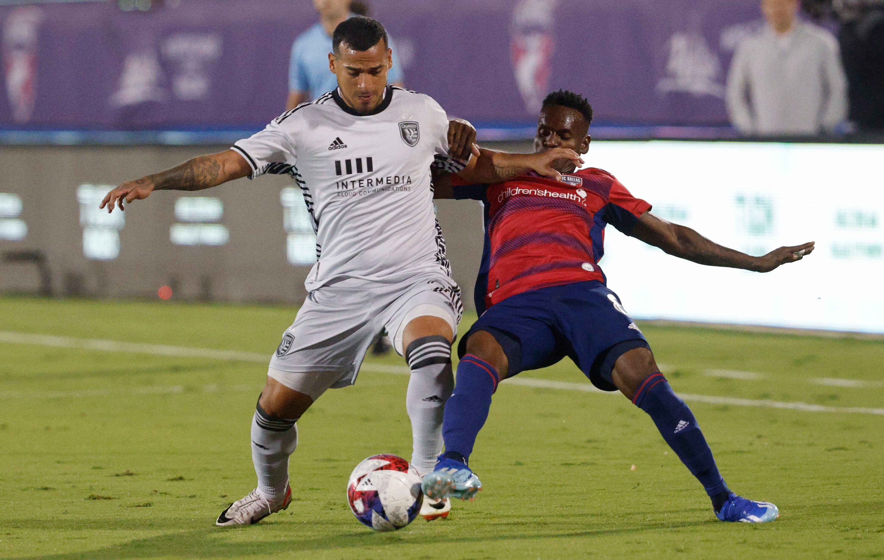 San Jose Earthquakes defender Miguel Trauco (21) and FC Dallas forward Jáder Obrian (8)...