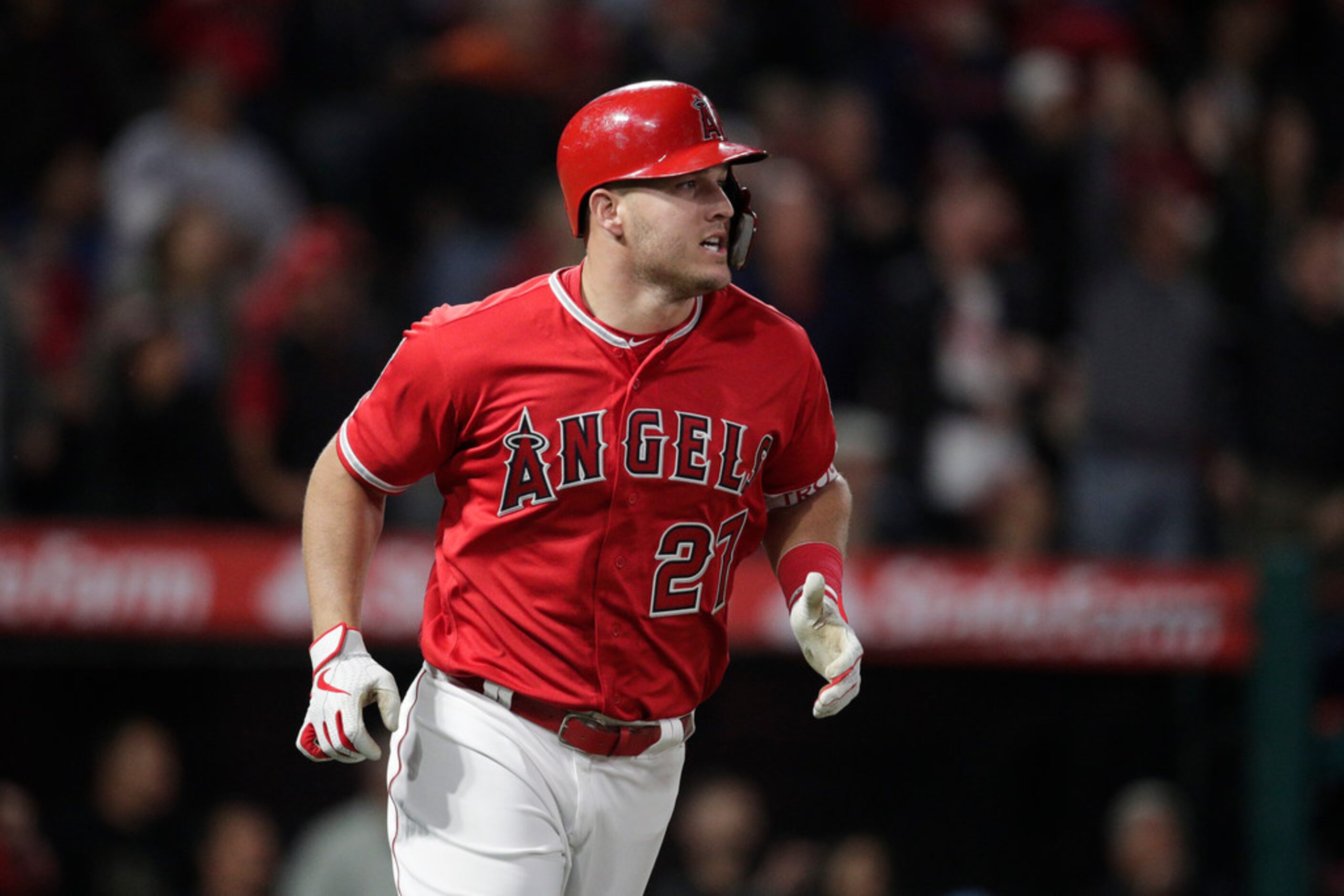 Los Angeles Angels' Mike Trout rounds the bases after hitting a home run during the sixth...