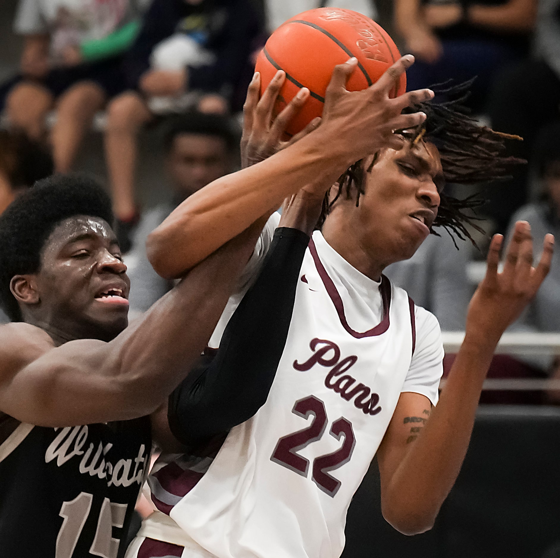 Plano forward Nikk Williams (22) is fouled by Denton Guyer forward Akintola Akinniyi (15) as...