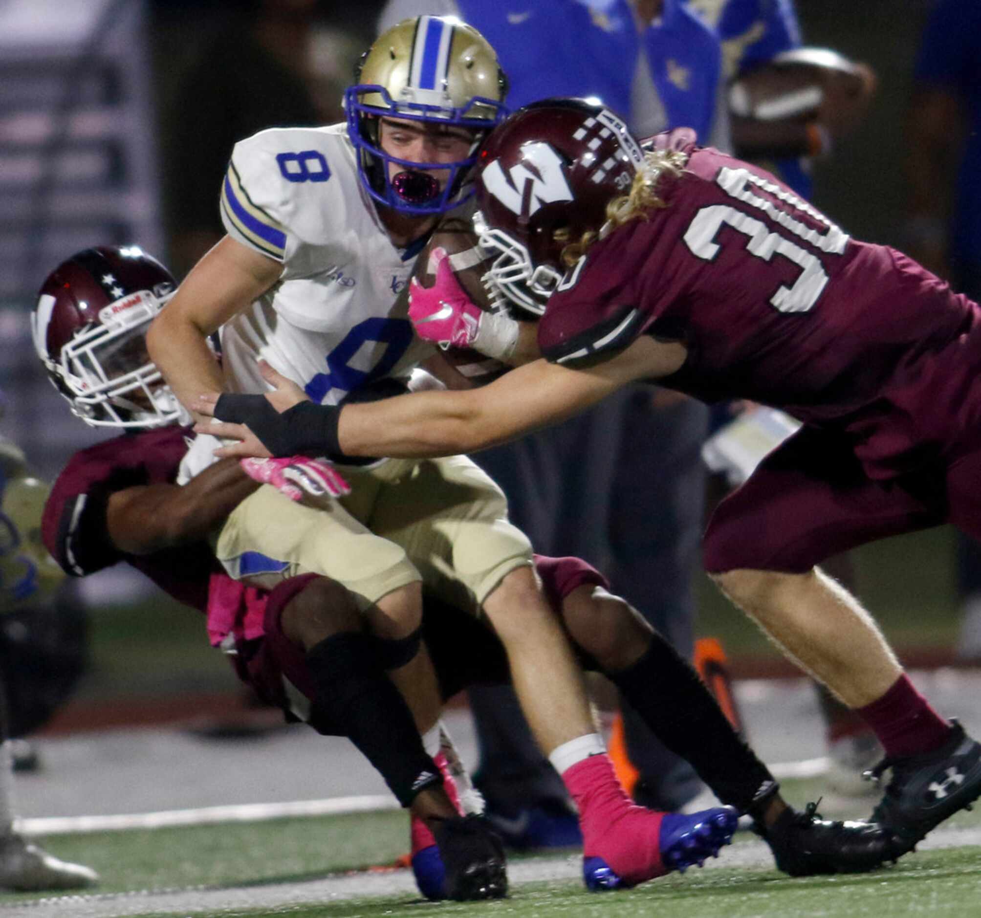 Garland Lakeview receiver Caleb Reed (8) is tackled after a first half reception by Wylie...