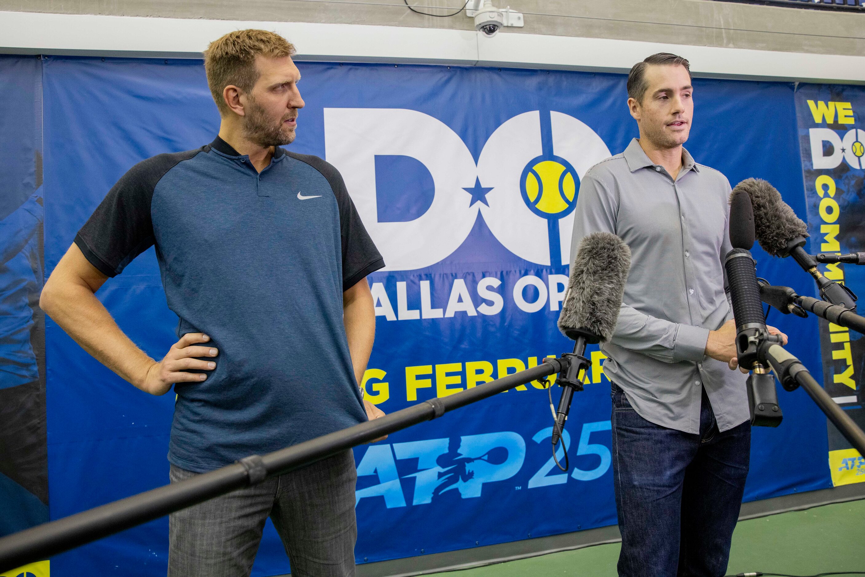 Dallas Mavericks star Dirk Nowitzki (left) listens to John Isner, 15-Time ATP Tour Champion,...