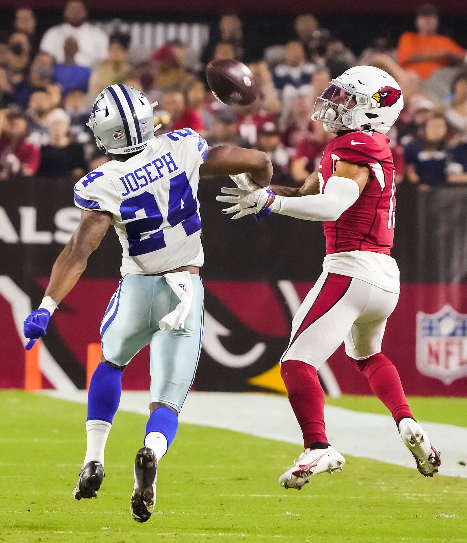 Arizona Cardinals wide receiver Christian Kirk (13) hauls in a long pass as Dallas Cowboys...