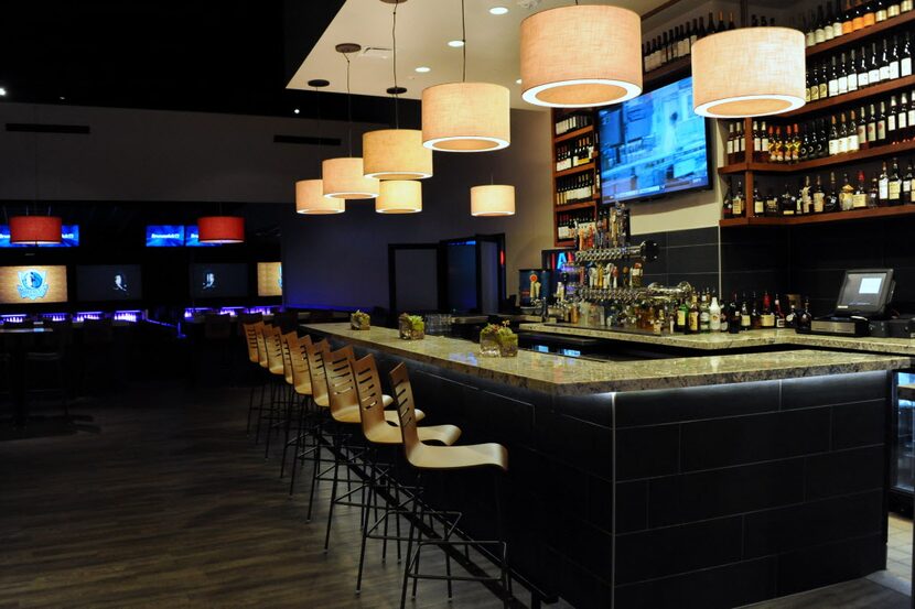 The bar at the bowling alley serves craft beer and cocktails.