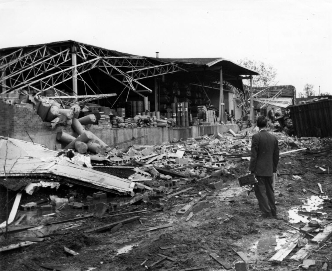 A man gets a closer look at a warehouse destroyed by the 1957 tornado in Dallas.